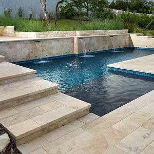 ivory travertine pool coping tumbled tiles, cream stepping coping, biege tiles by stone pavers melbourne and sydney